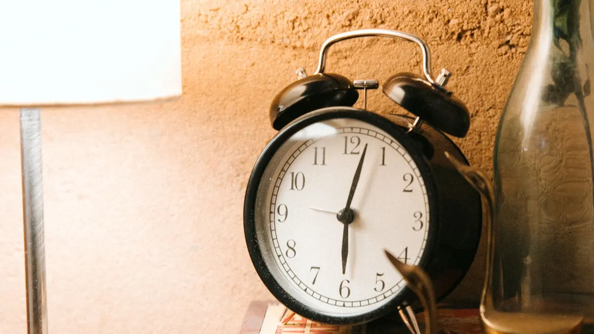 Vintage alarm clock on a bedside table