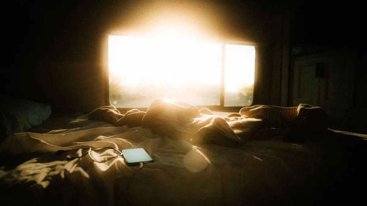 Morning sunlight through a bedroom window