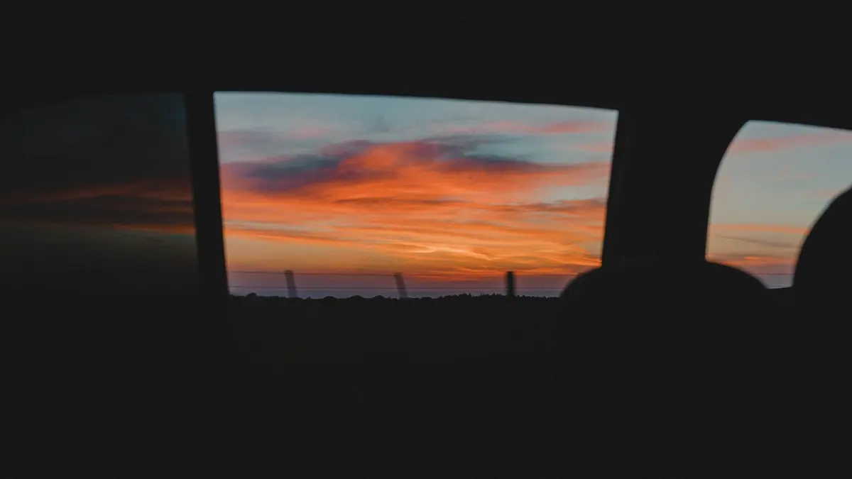 Low sunset glare through a car window