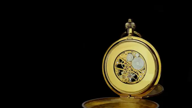 Gold pocket watch gears close up