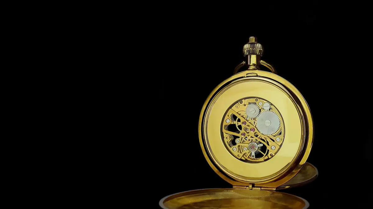 Gold pocket watch gears close up